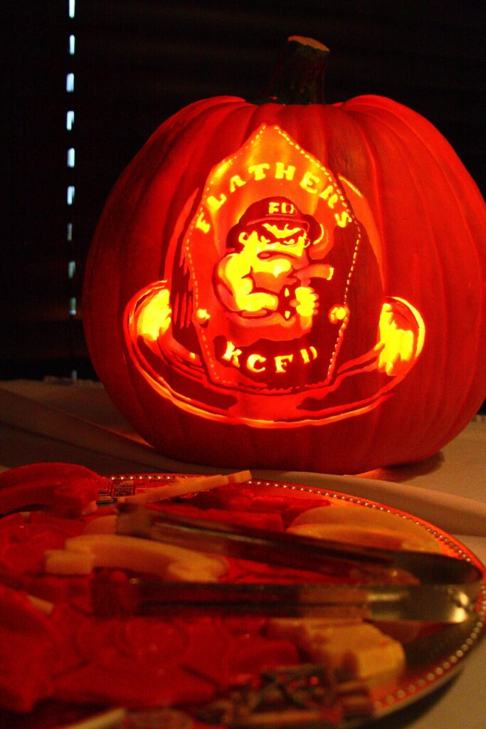 A Pumpkin I Had Carved For My Firefighter Husband For Our Wedding For His Groom s Cake Table Firefighter Wedding Firefighter Pumpkin Obsession